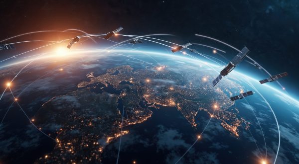 Dynamic 3D rendering of multiple satellites in orbit around Earth. Illuminated continents showcase global connectivity. Illustrates advanced space technology communication networks. Complex orbital