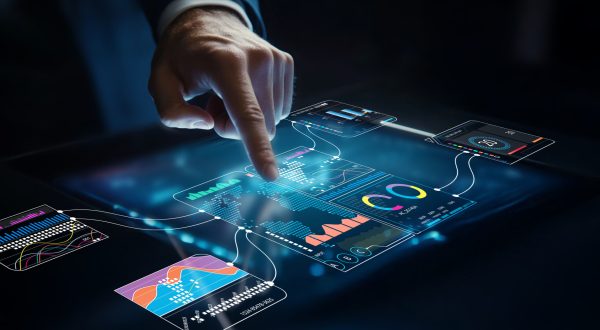 A business professional engages with a modern digital data interface, using hand gestures to interact with charts and metrics in a dark, futuristic setting.